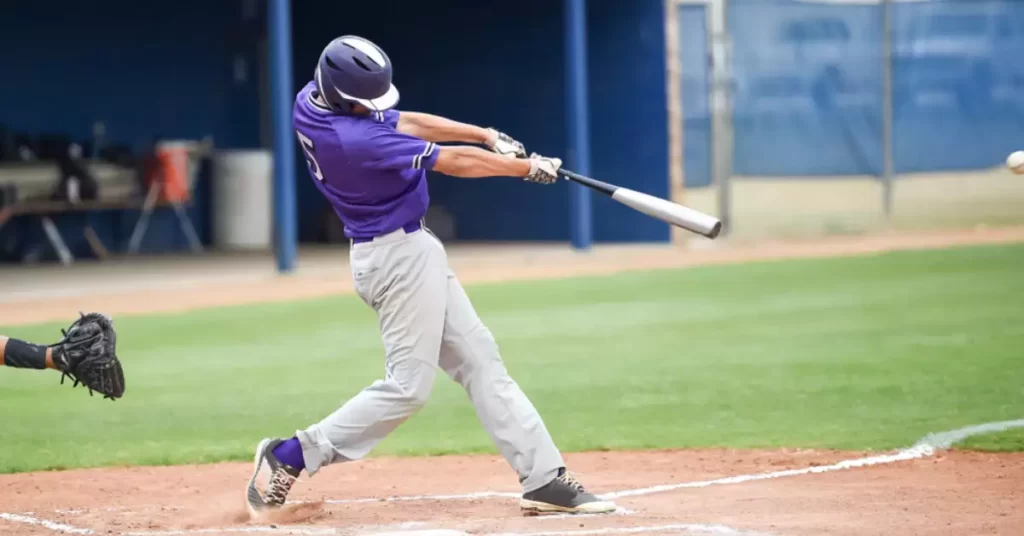 Baseball Player hits a ball